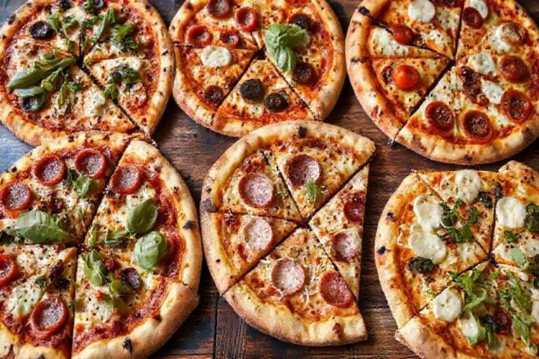 Array of delicious pizzas with various toppings.